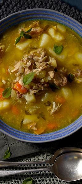 Chicken, potato and vegetable soup with basil