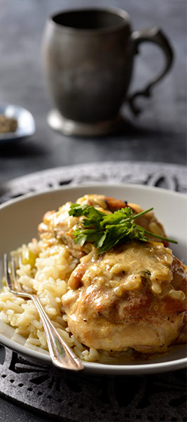 Chicken thighs in a creamy mustard sauce, served with creamy rice