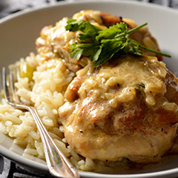 Chicken thighs in a creamy mustard sauce, served with creamy rice